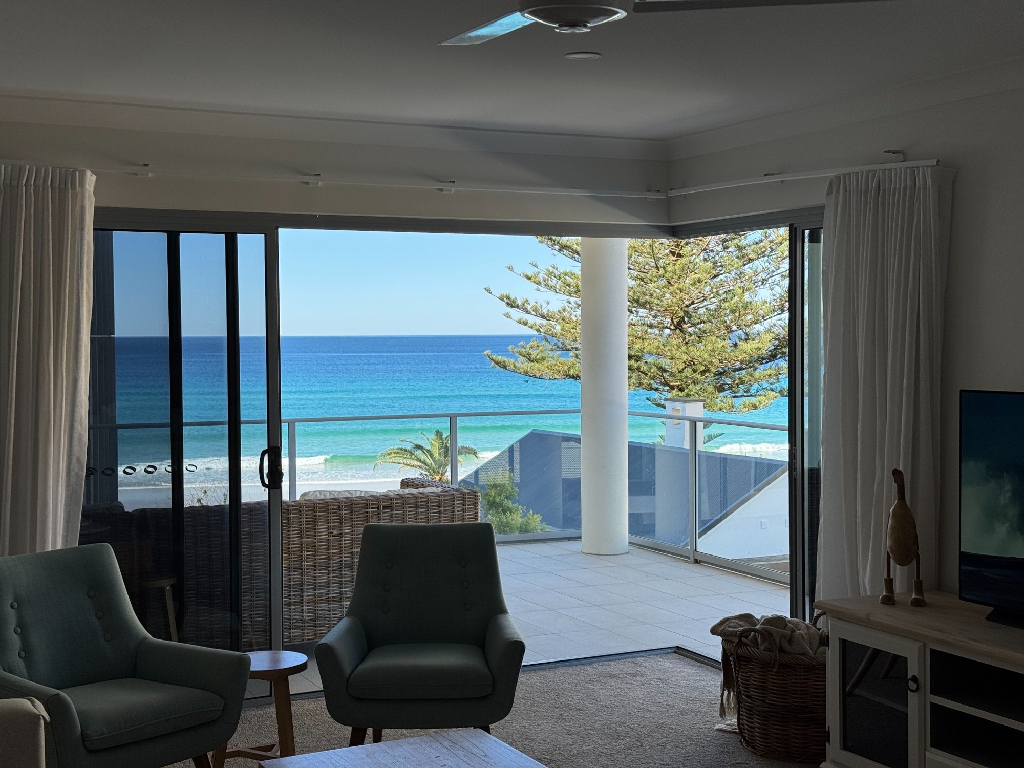 Ocean and balcony view from the Palm Beach apartment living area